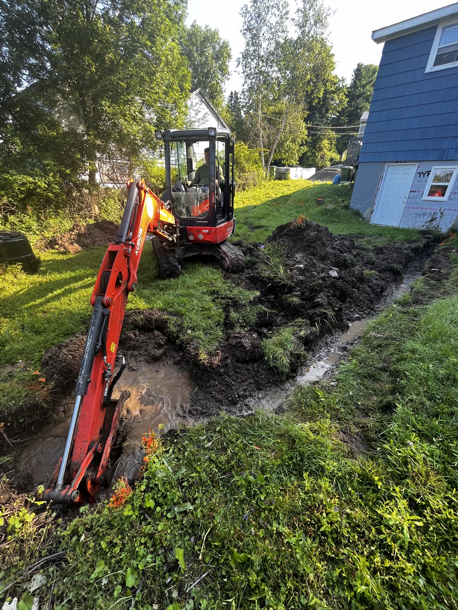 Landscaping and excavation project by Green Apple Landscaping Builders